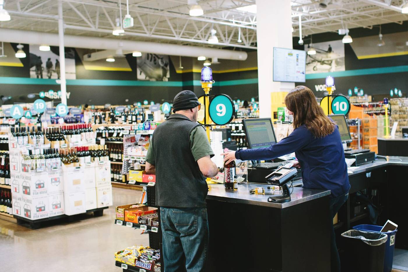 Team members at the checkout lanes of a real mPower customer store